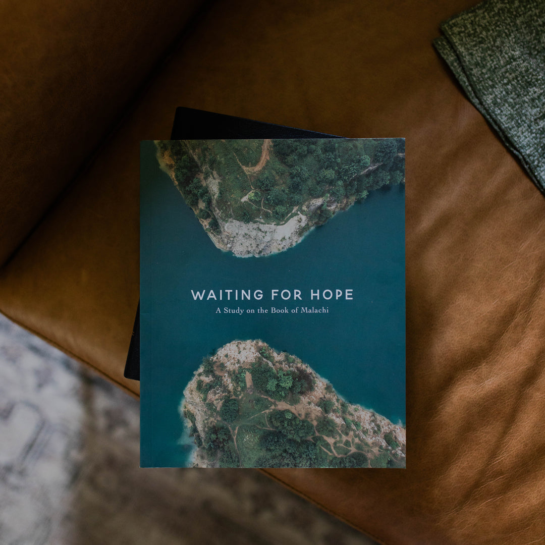 Mens Malachi Waiting for Hope Bible Study Cover on a black book sitting on a leather couch