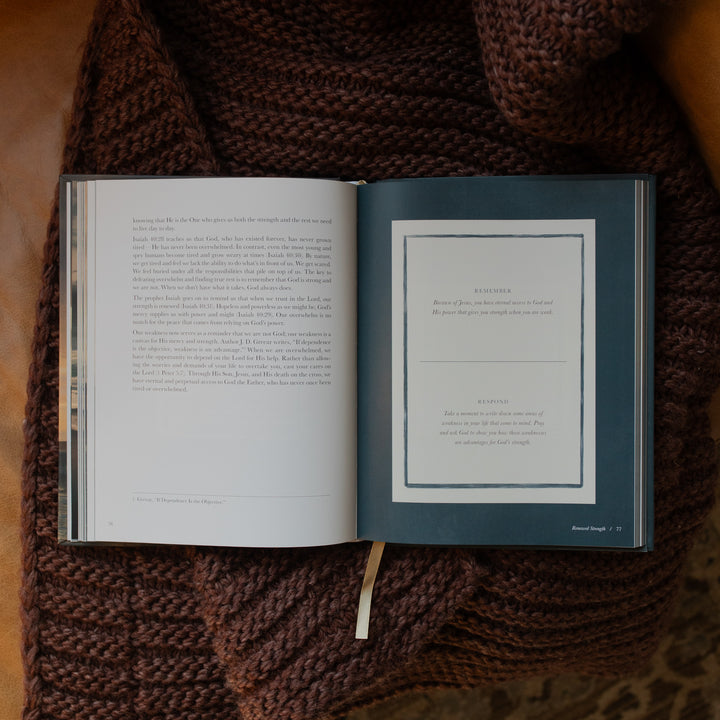 New and Never Ending Mercies opened to the Remember and Respond page on a brown knitted blanket on a leather couch