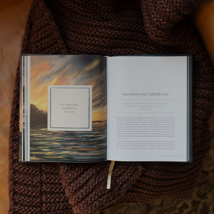 New and Never Ending Mercies opened to the Goodness and Faithful Love page on a brown knitted blanket on a leather couch
