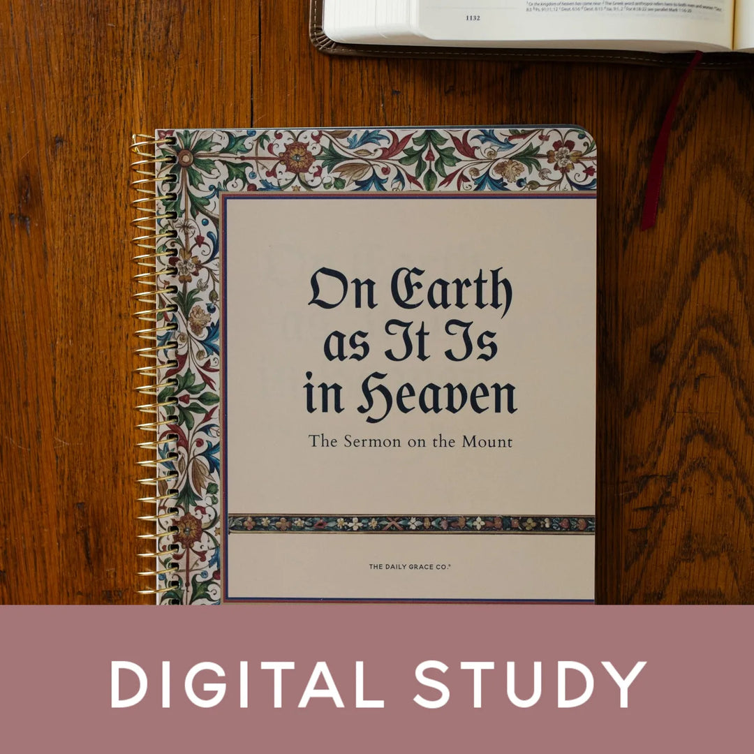 A spiral-bound book titled "On Earth as It Is in Heaven: The Sermon on the Mount" lies on a wooden surface, with an open book partially visible at the top and a mauve banner at the bottom reading "DIGITAL STUDY.".