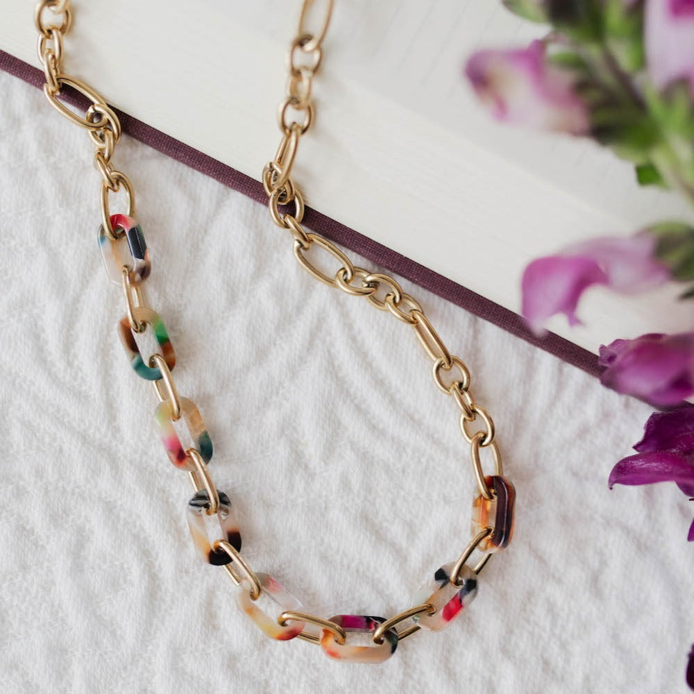 Featuring 14k gold-plated stainless steel chain necklace with and multicolor resin links