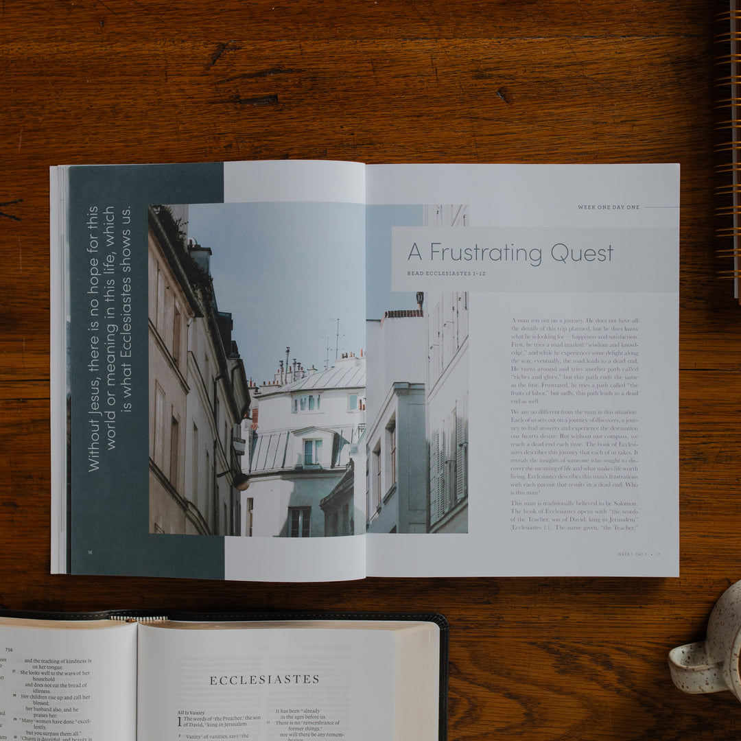 The Path to Purpose opened to the Week One Day One page on a wooden table near an open bible
