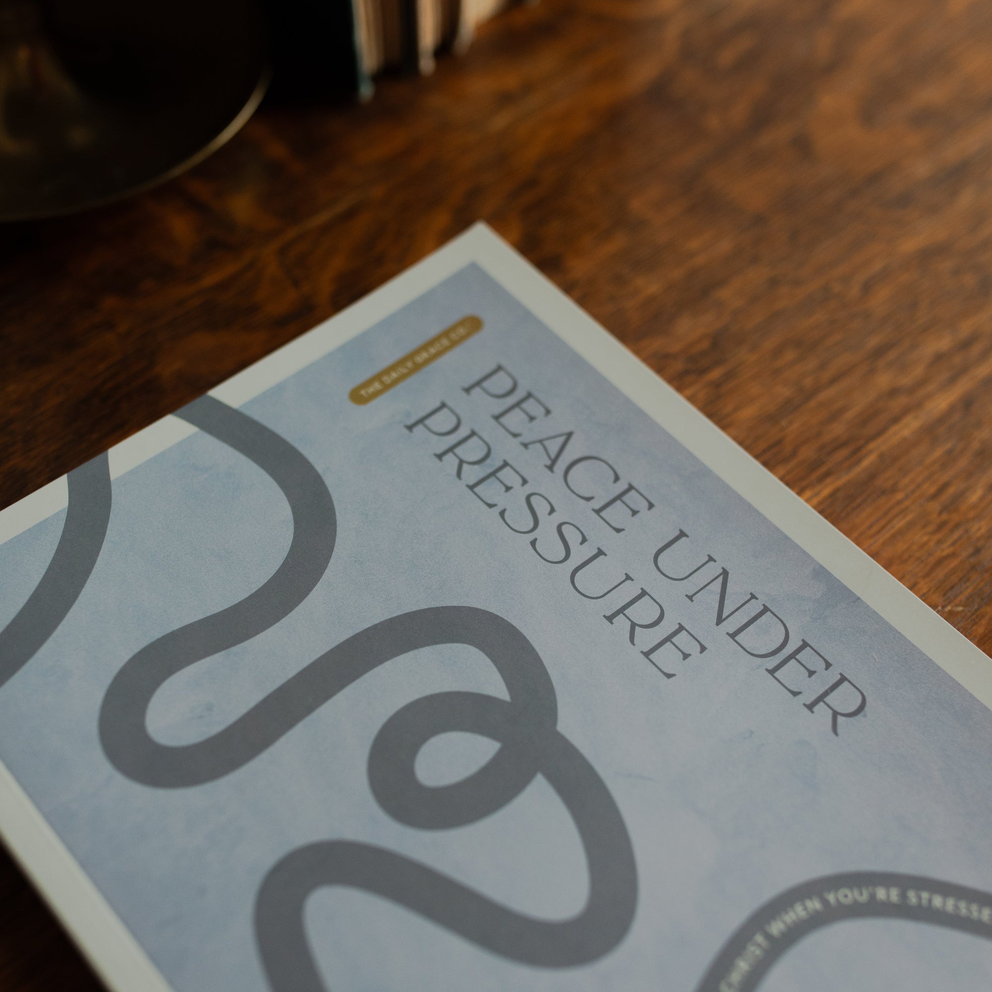 Up close of the Peace Under Pressure Study Cover on a wooden table