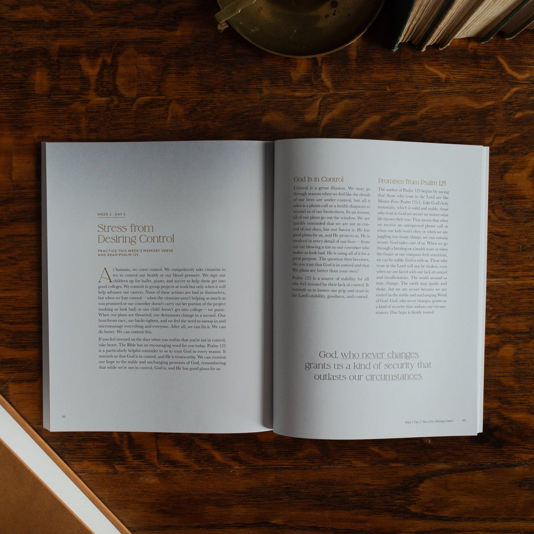 Peace Under Pressure Study opened to the stress from desiring control page on a wooden table