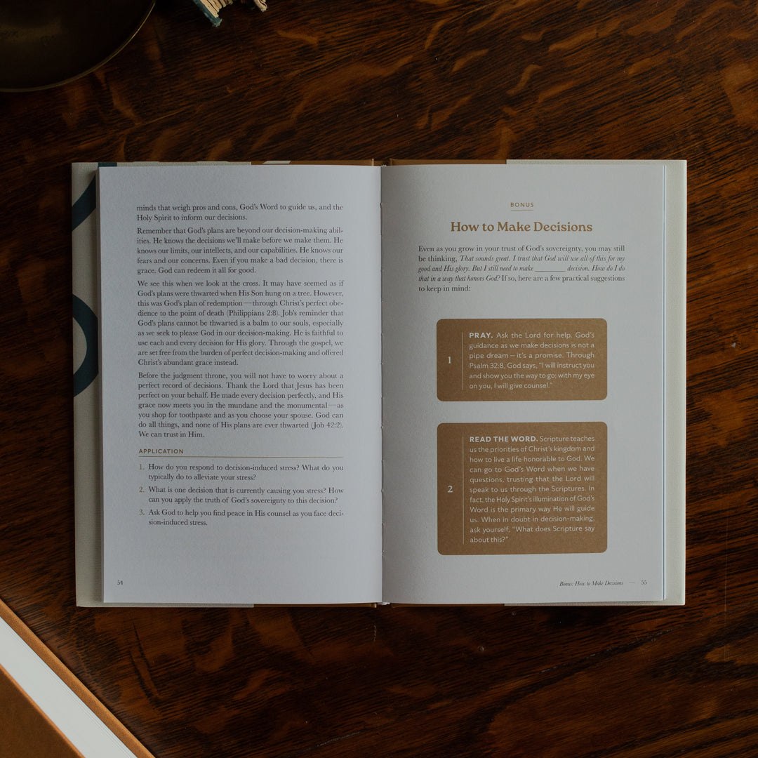 Peace Under Pressure Mens opened to the Bonus page on a wooden table next to a journal