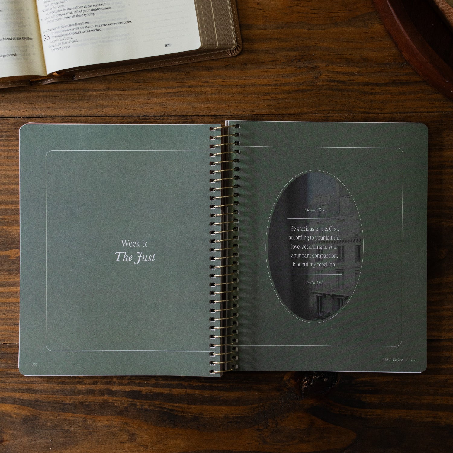 Peaks and Valleys Spiral Study opened to week 5 start page next to a dark brown wooden tray and an open bible on a brown wooden table