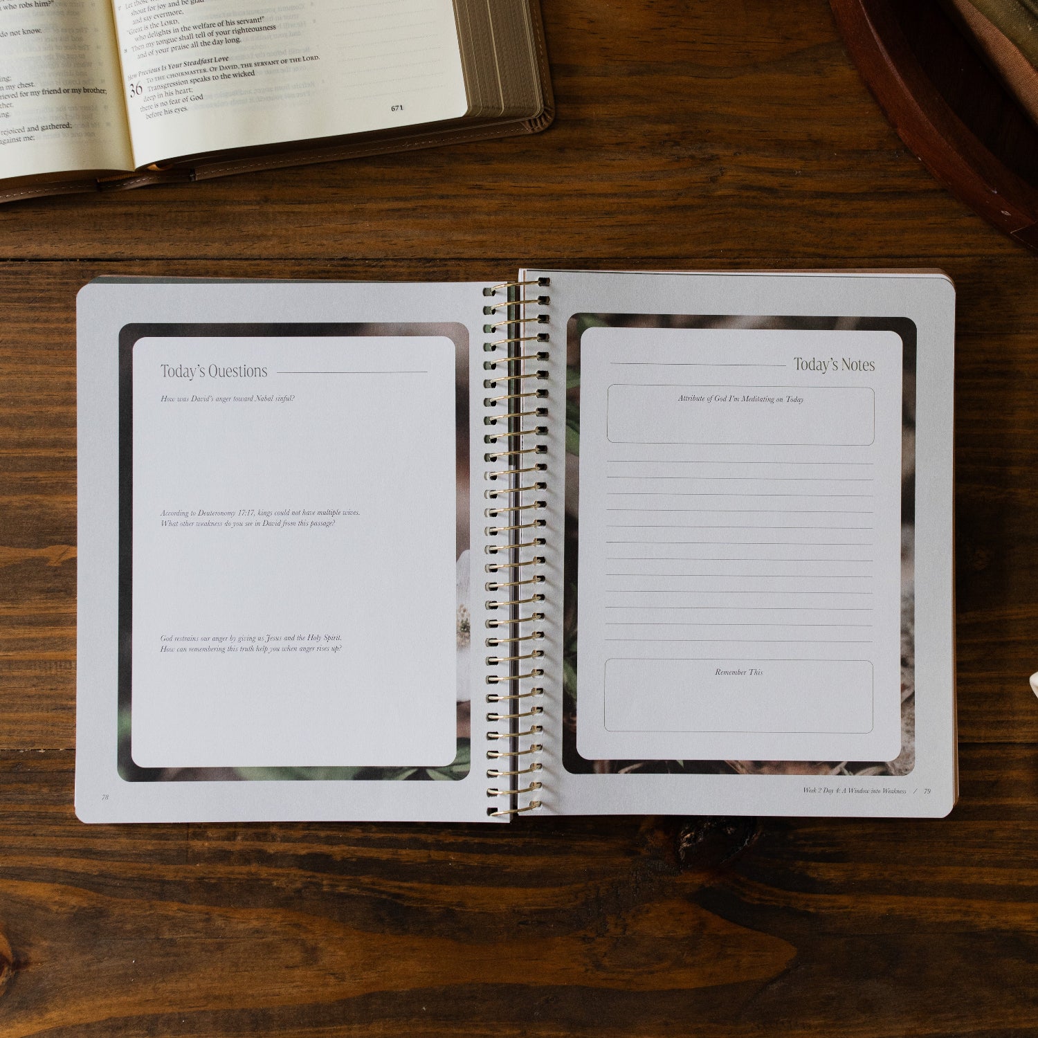 Peaks and Valleys Spiral Study opened to the Week 2 Day 4 question and note page next to a dark brown wooden tray and an open bible on a brown wooden table