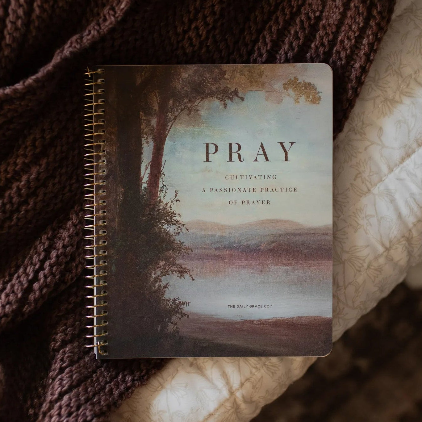 The Pray spiral study cover on a woven blanket 