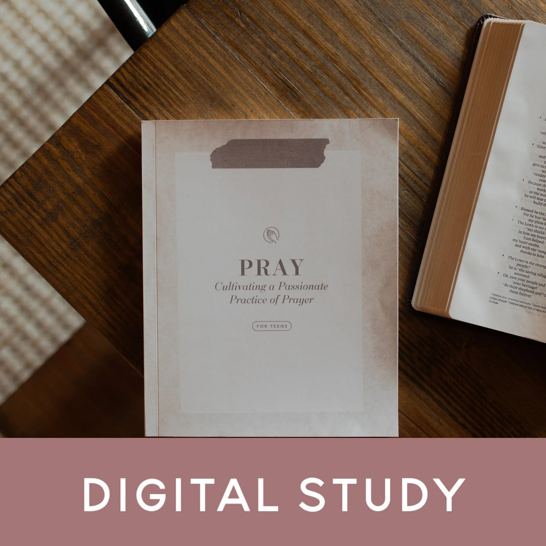 The Pray study cover on a wooden table near an open bible with a banner that says Digital Study