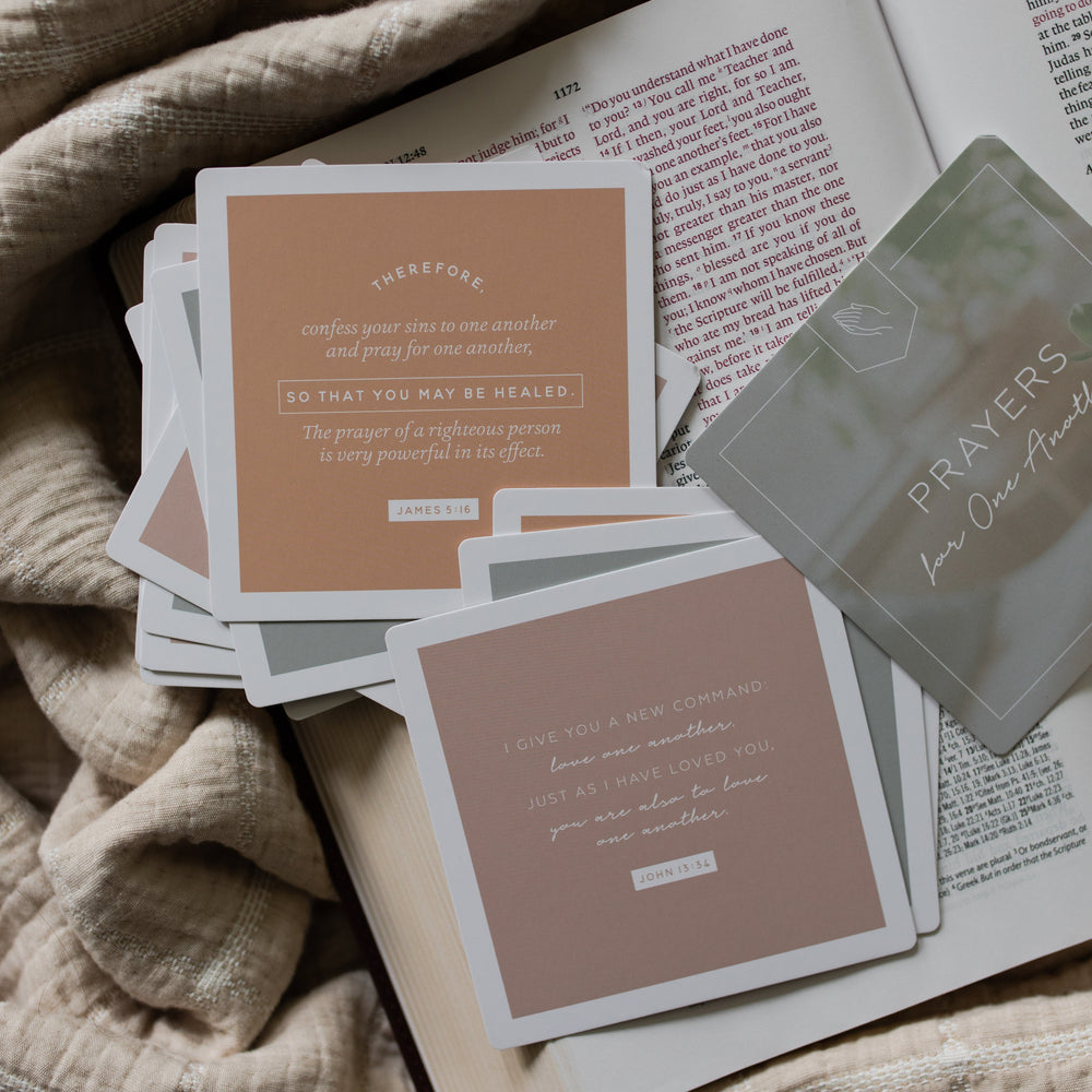 Multiple Prayers for One Another verse cards with rounded corners on an open bible