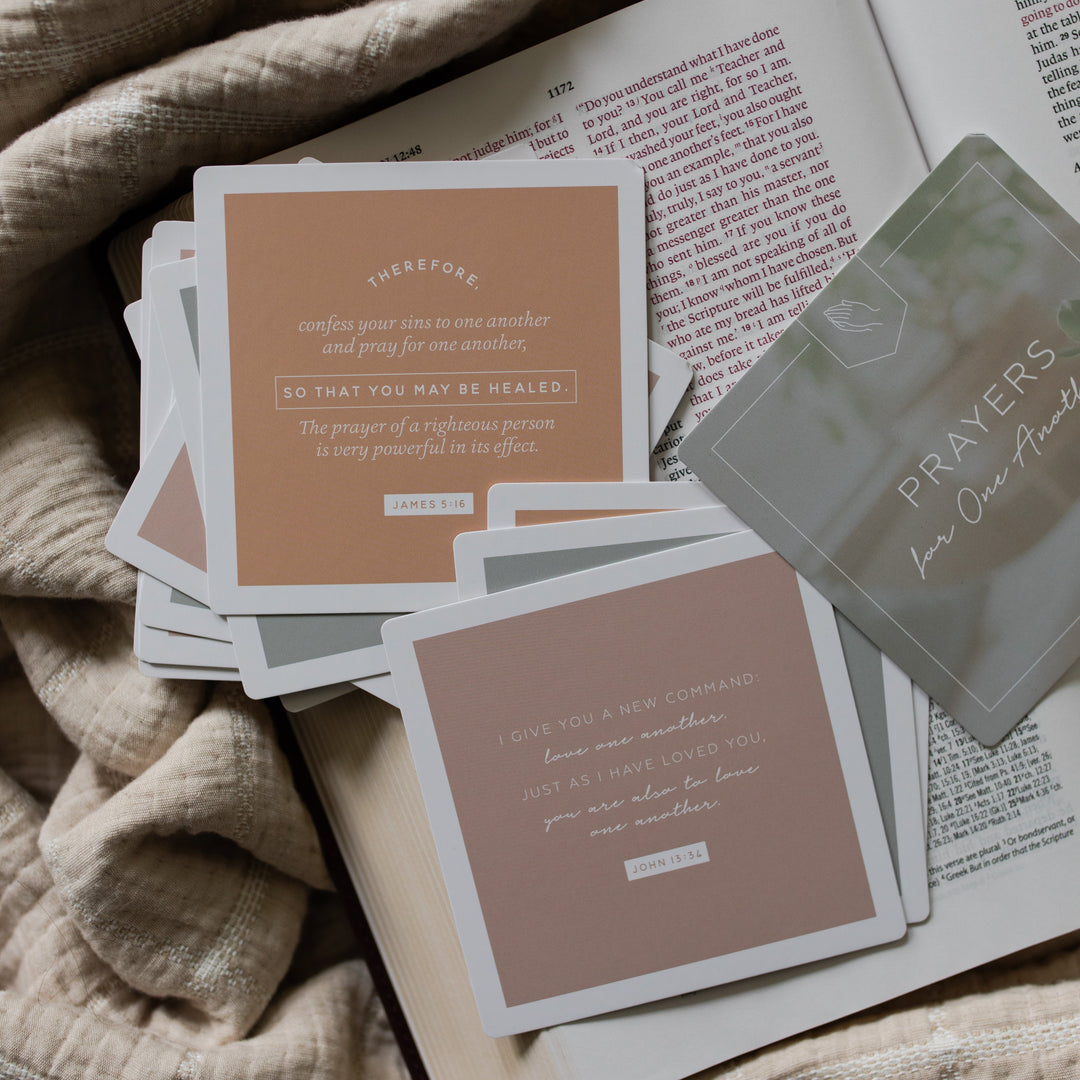 Multiple Prayers for One Another verse cards with rounded corners on an open bible