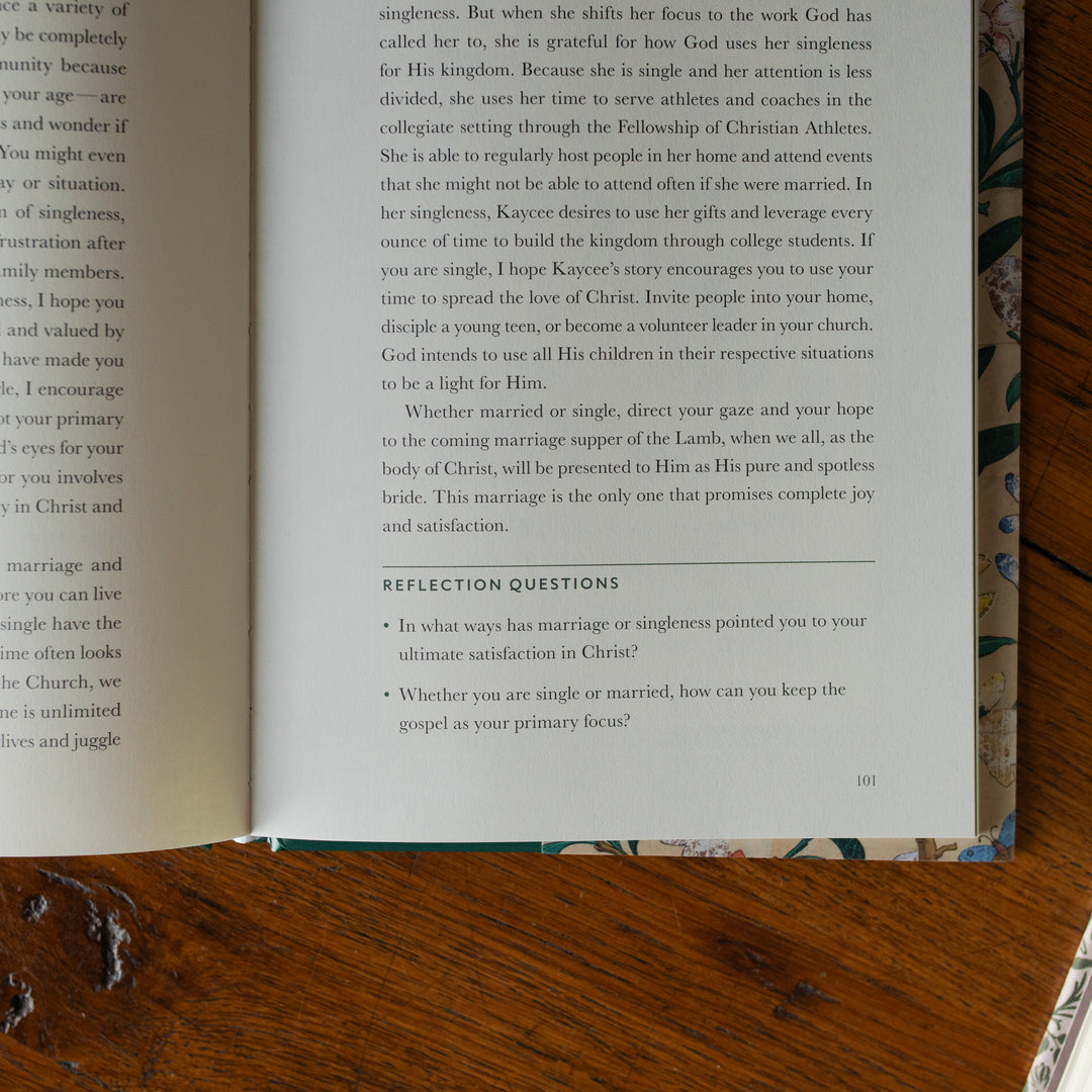 Preaching the Gospel to yourself opened to an up close section of the reflection questions page on a wooden table