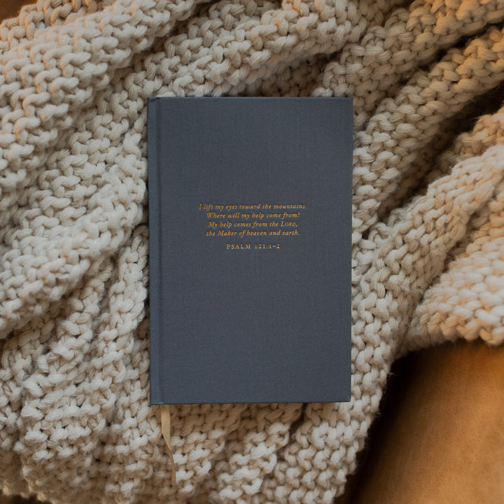 The Psalm 121 Dotted Journal cover on a white knitted blanket