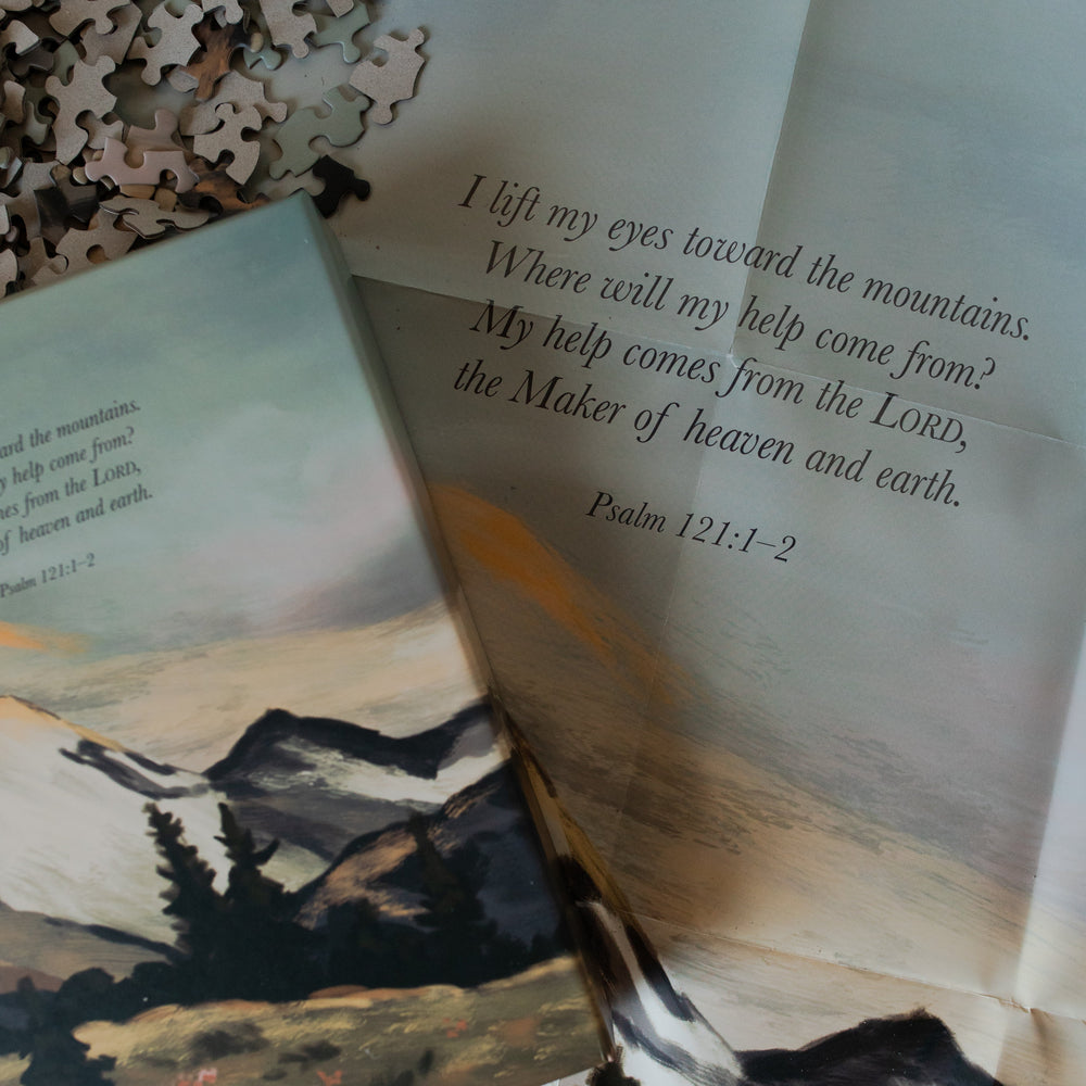 Psalm 121 Puzzle box laying on the puzzle poster on the table