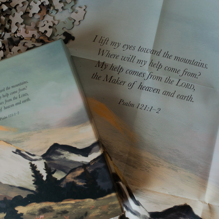 Psalm 121 Puzzle box laying on the puzzle poster on the table
