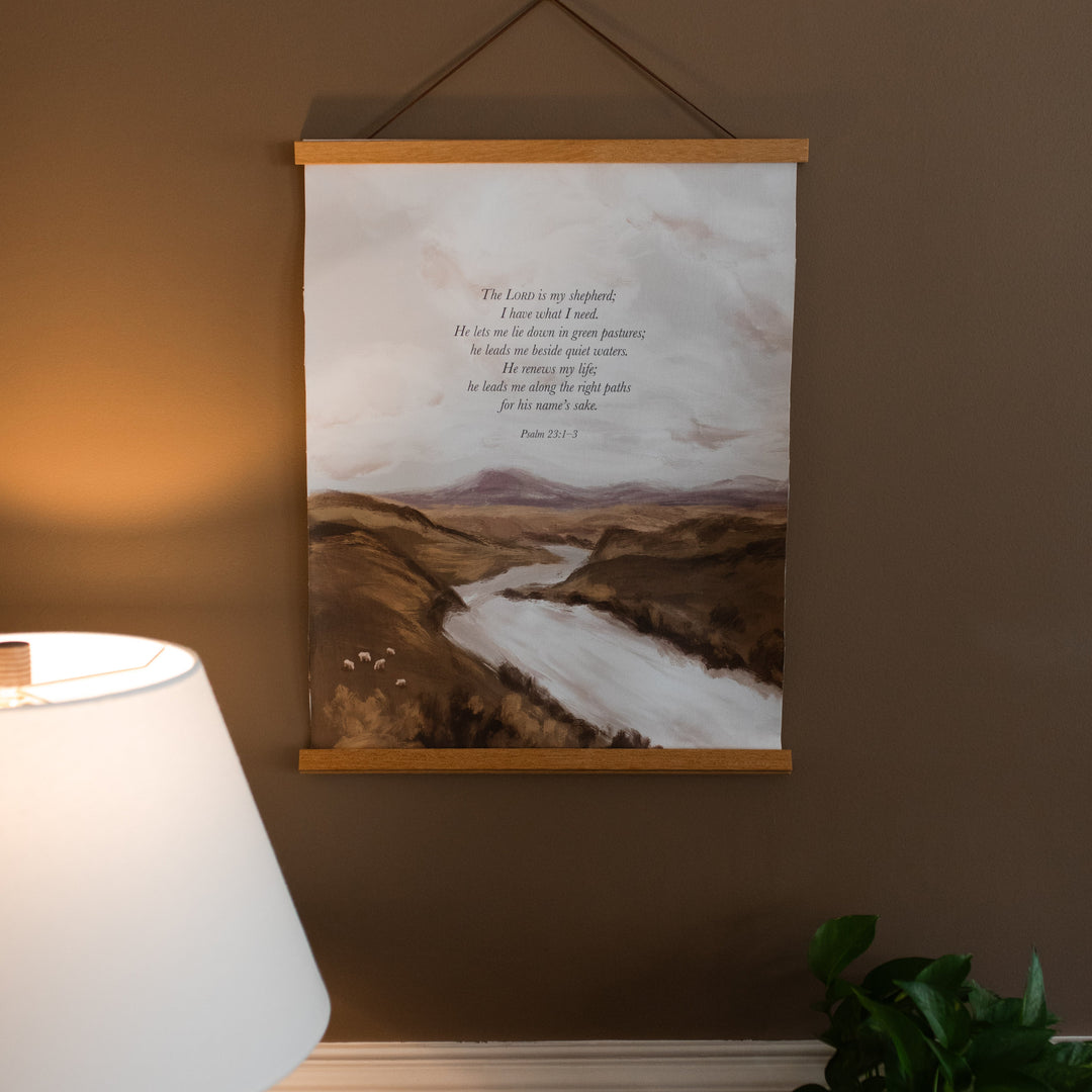 Psalms 23 Canvas print on a brown wall with a lamp nearby