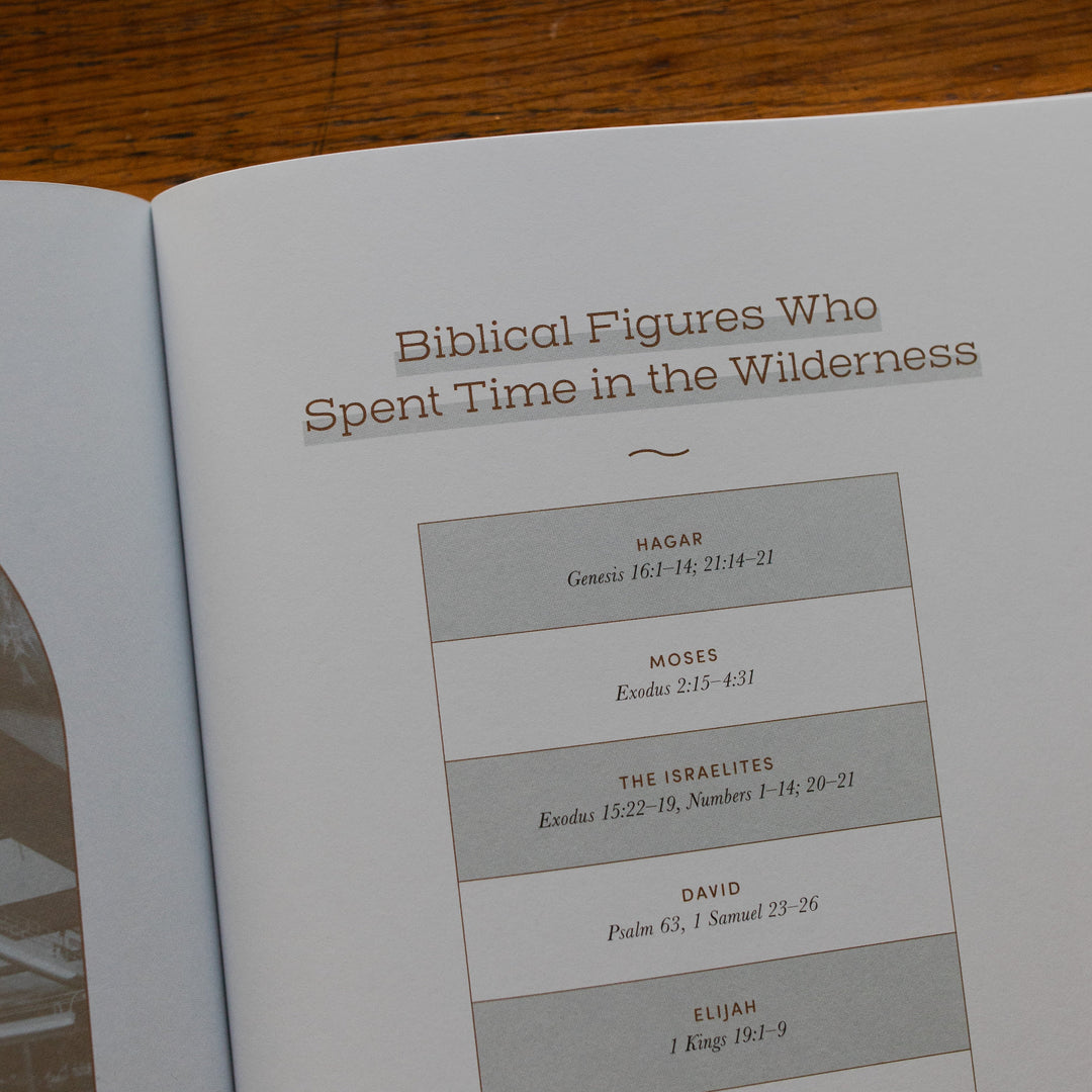 Rivers of Renewal Study up close of Biblical figures who spent time in the wilderness page laying on a brown wooden table