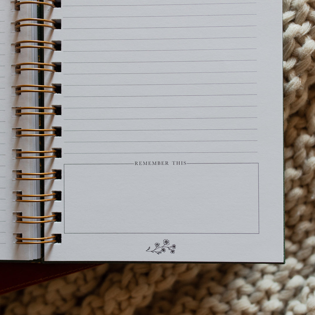 Up close of The Sermon Notes Journal with Green Floral remember this section at the bottom of the page on a knitted blanket