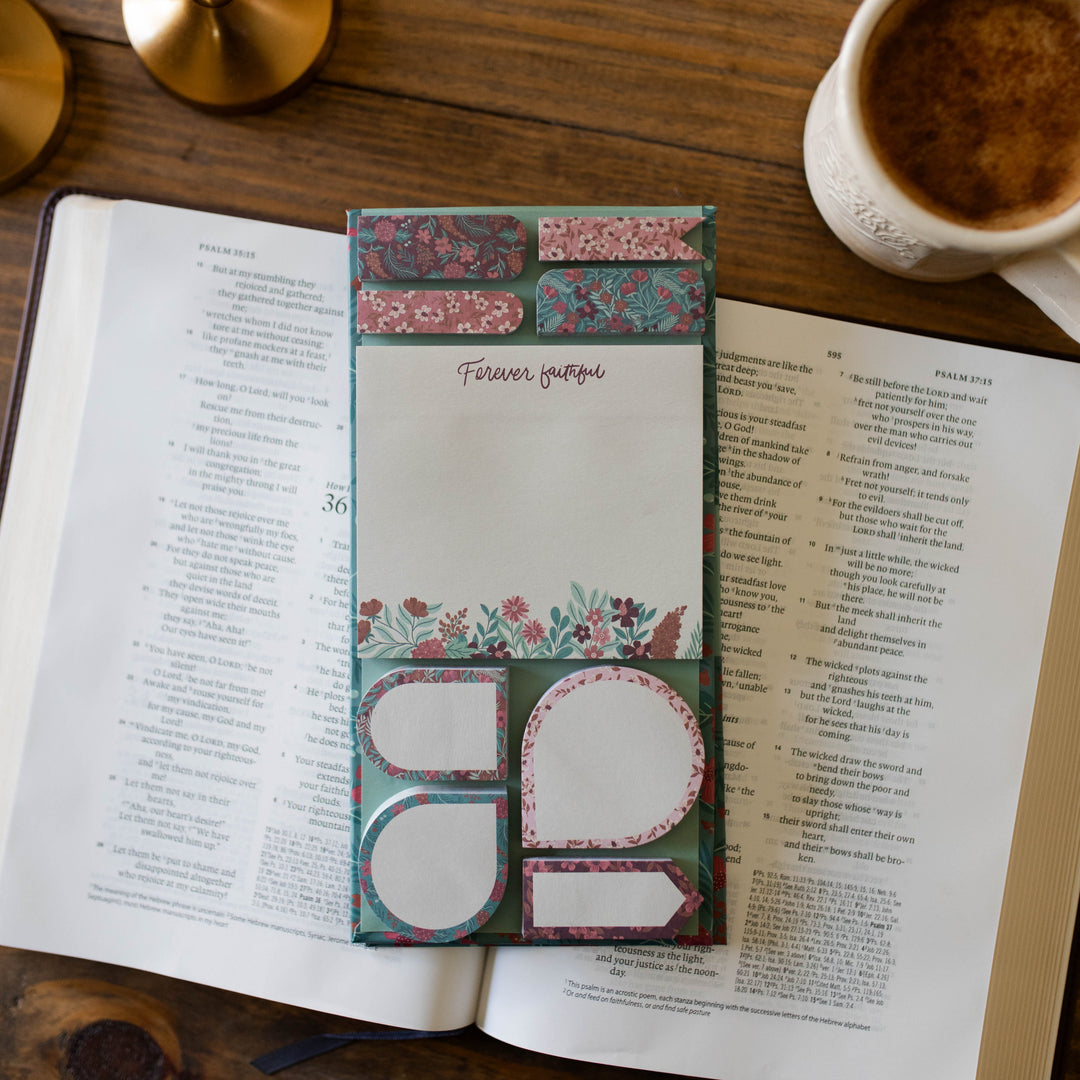 9 different size sticky notes with floral pattern on Bible