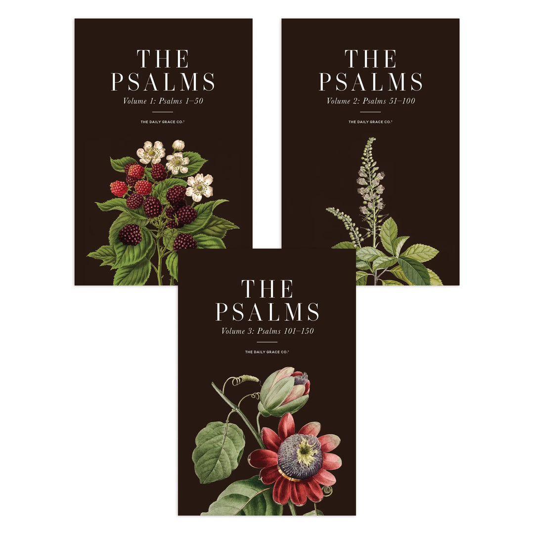 Three book covers for 'The Psalms' volumes arranged on a white background. The covers are dark brown with white serif text and botanical illustrations, including red berries, white flowers, green leaves, and a red passionflower.