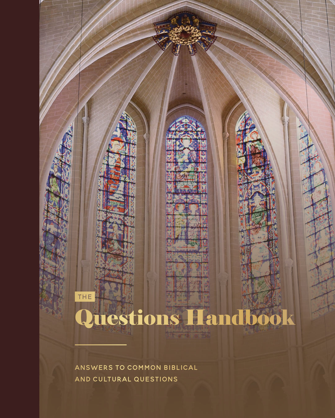 Book cover of 'The Questions Handbook' with stained glass windows in the background