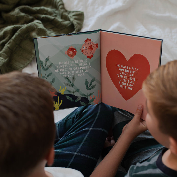 Two children reading The Promise of Christmas book 