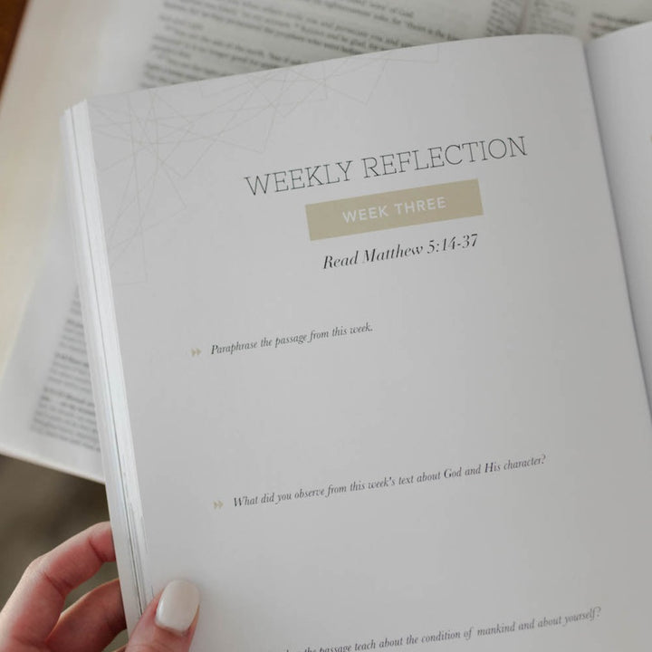 Bible Study open to page with weekly reflection questions