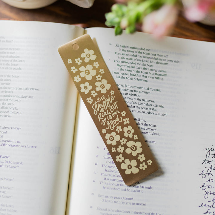 brass bookmark showing print and text