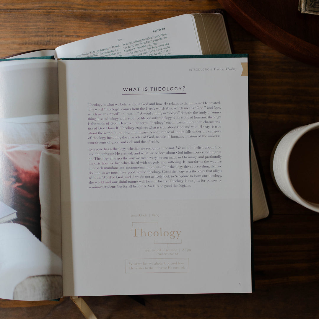 Open book on a wooden table with a cup of coffee