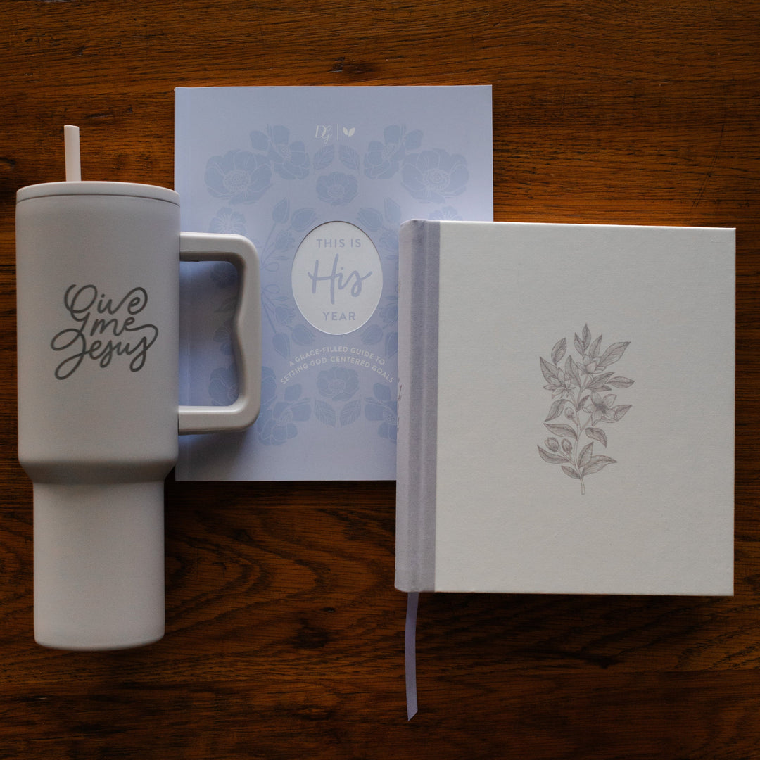 This is His Year Faith workbook, ESV Journaling Study Bible Blessing and Give Me Jesus taupe tumbler bundle on a table