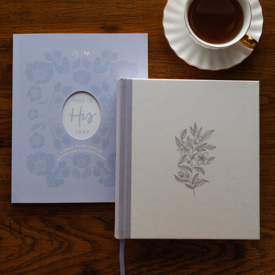 This is His Year Faith Workbook and Bible on a table with tea