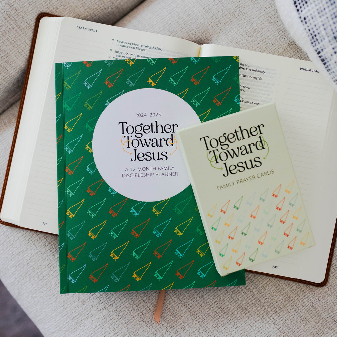 photo of planner and prayer cards on top of Bible