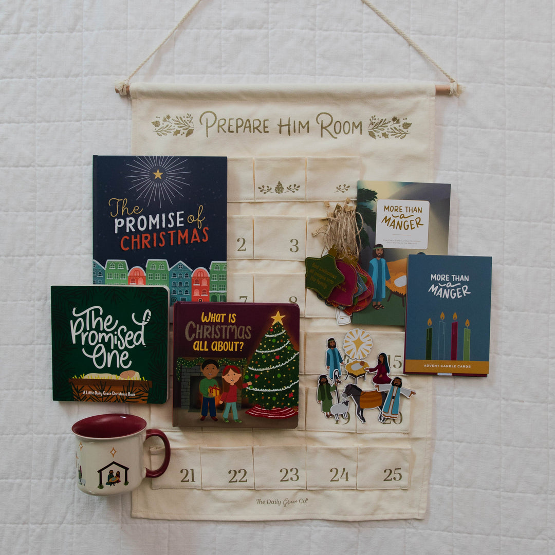 Ultimate family bundle for advent features a wall calendar, children's book books, family devotional, candle cards, family ornaments, magnets and a mug