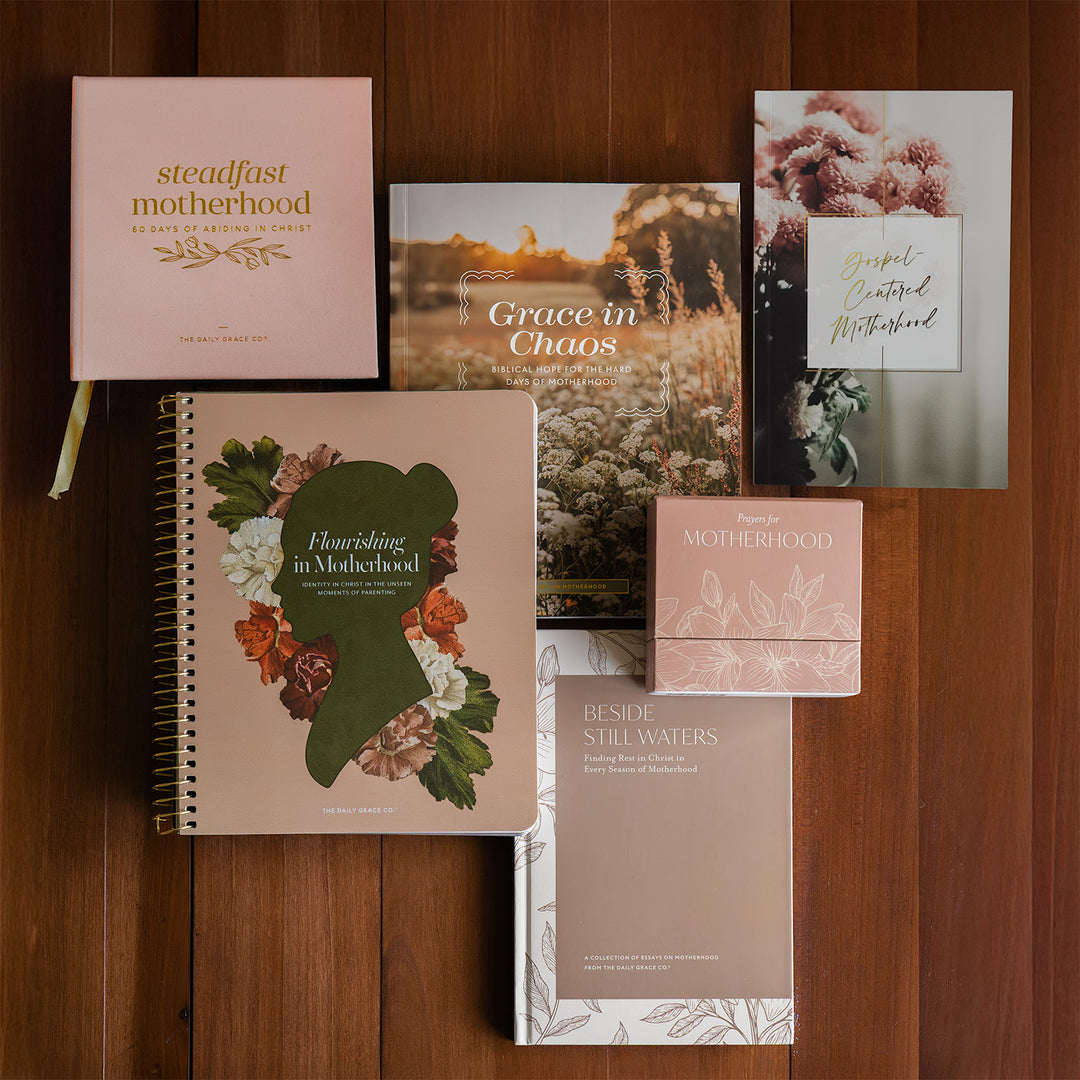 The Entire Ultimate Motherhood Bundle on a wooden table