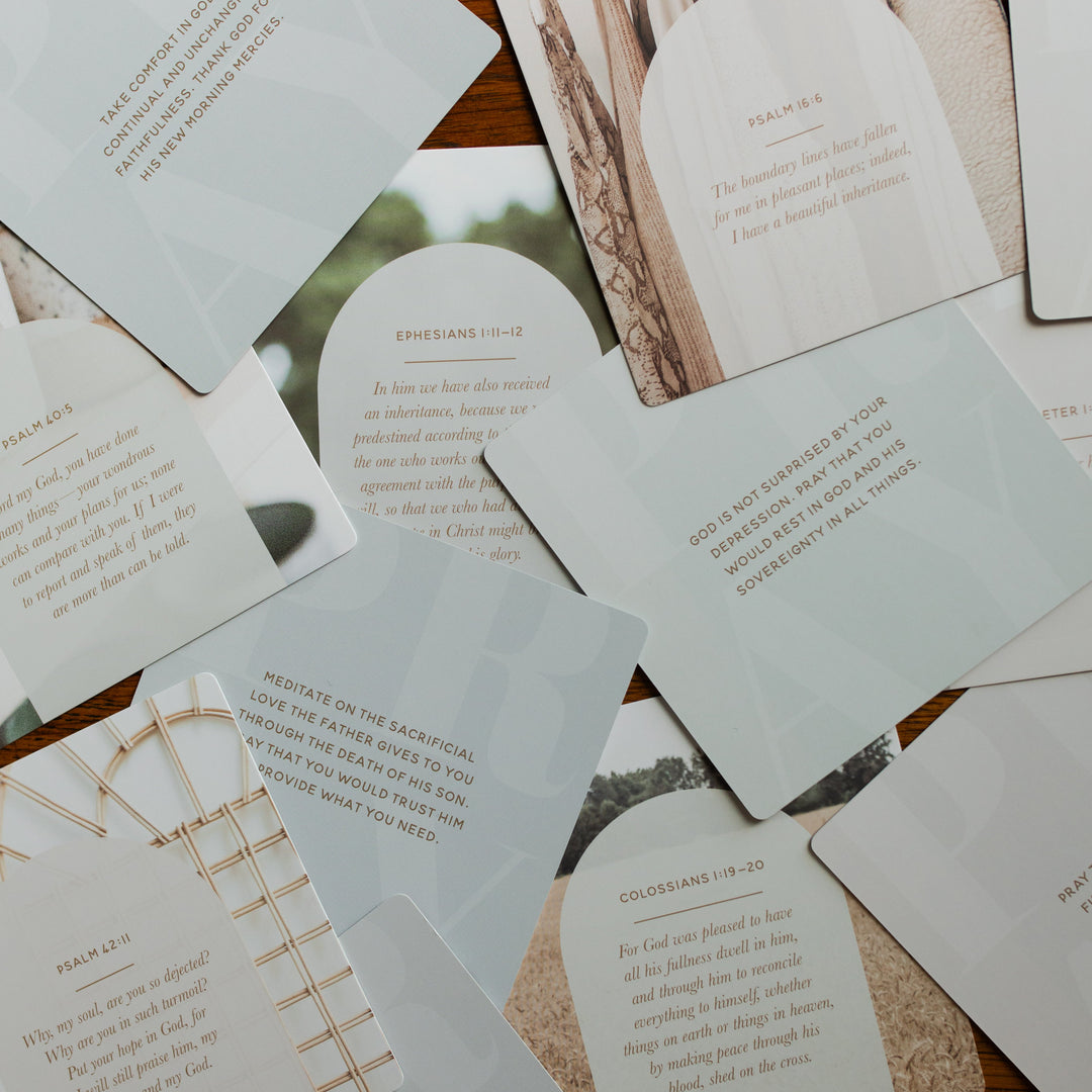 Verse Cards for Depression scattered on a wooden table