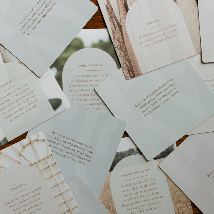 Verse Cards for Depression scattered on a wooden table
