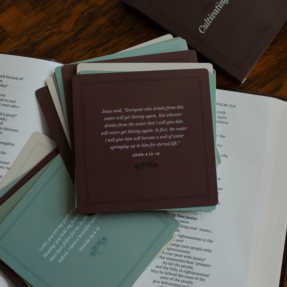 Verses for Cultivating Contentment verse cards spread over an open bible