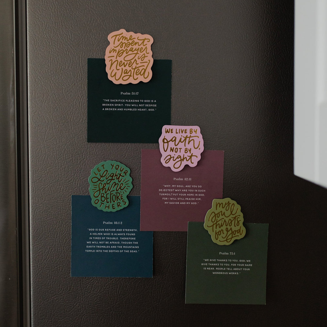 Set of 4 Walk by Faith Magnets holding verse cards on a refrigerator