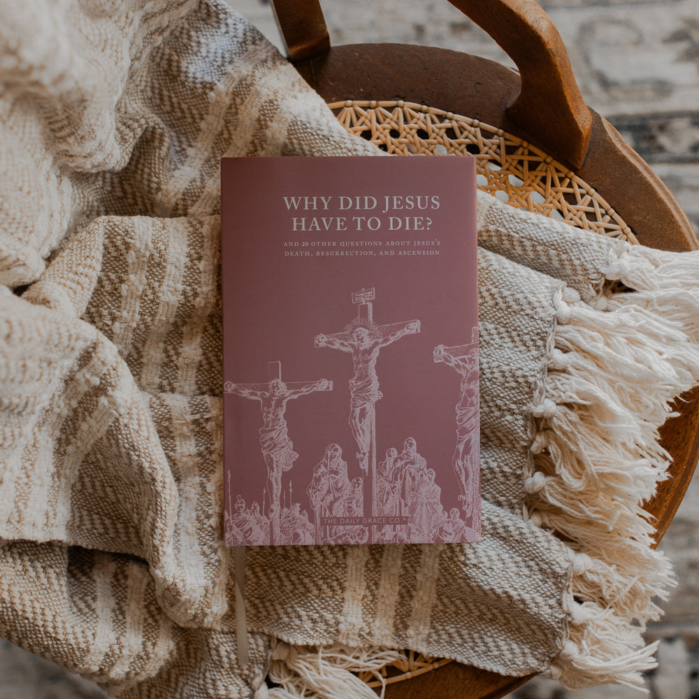 Why Did Jesus Have To Die cover on a blanket and a woven chair