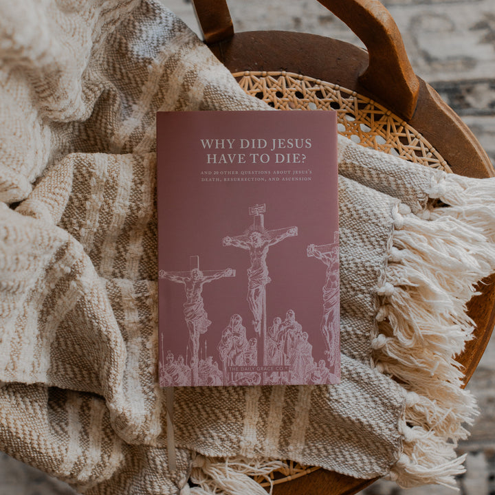 Why Did Jesus Have To Die cover on a blanket and a woven chair
