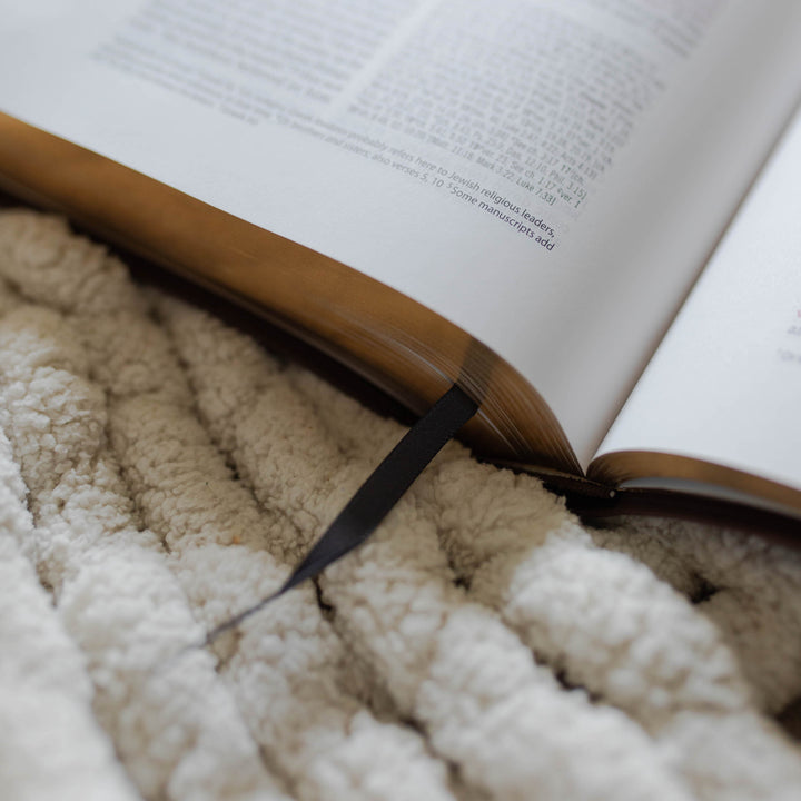 Black fabric bookmark in Bible