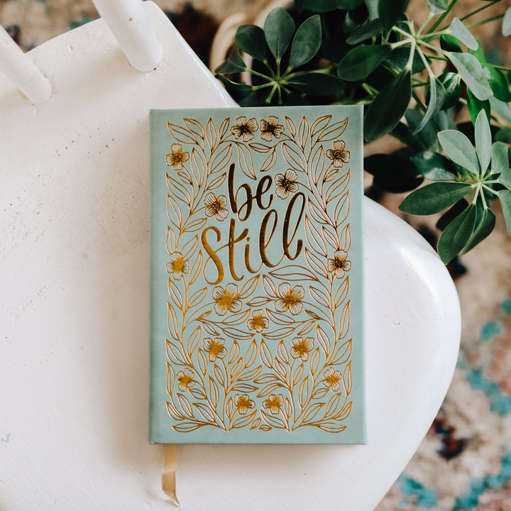 Be still bible study journal on chair