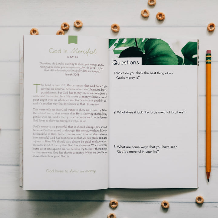 Bible study open on table to page of questions surrounded by pencil and cereal