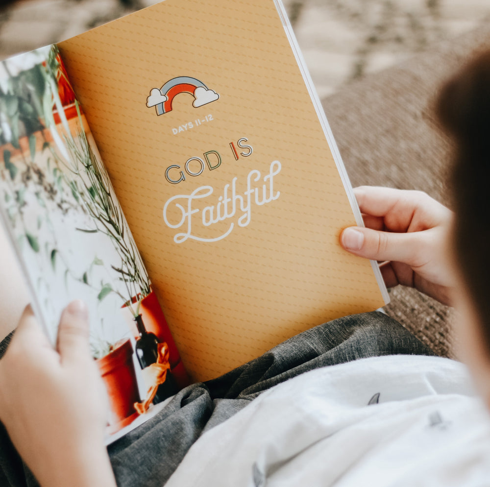 Child looking at Bible Study colorful page