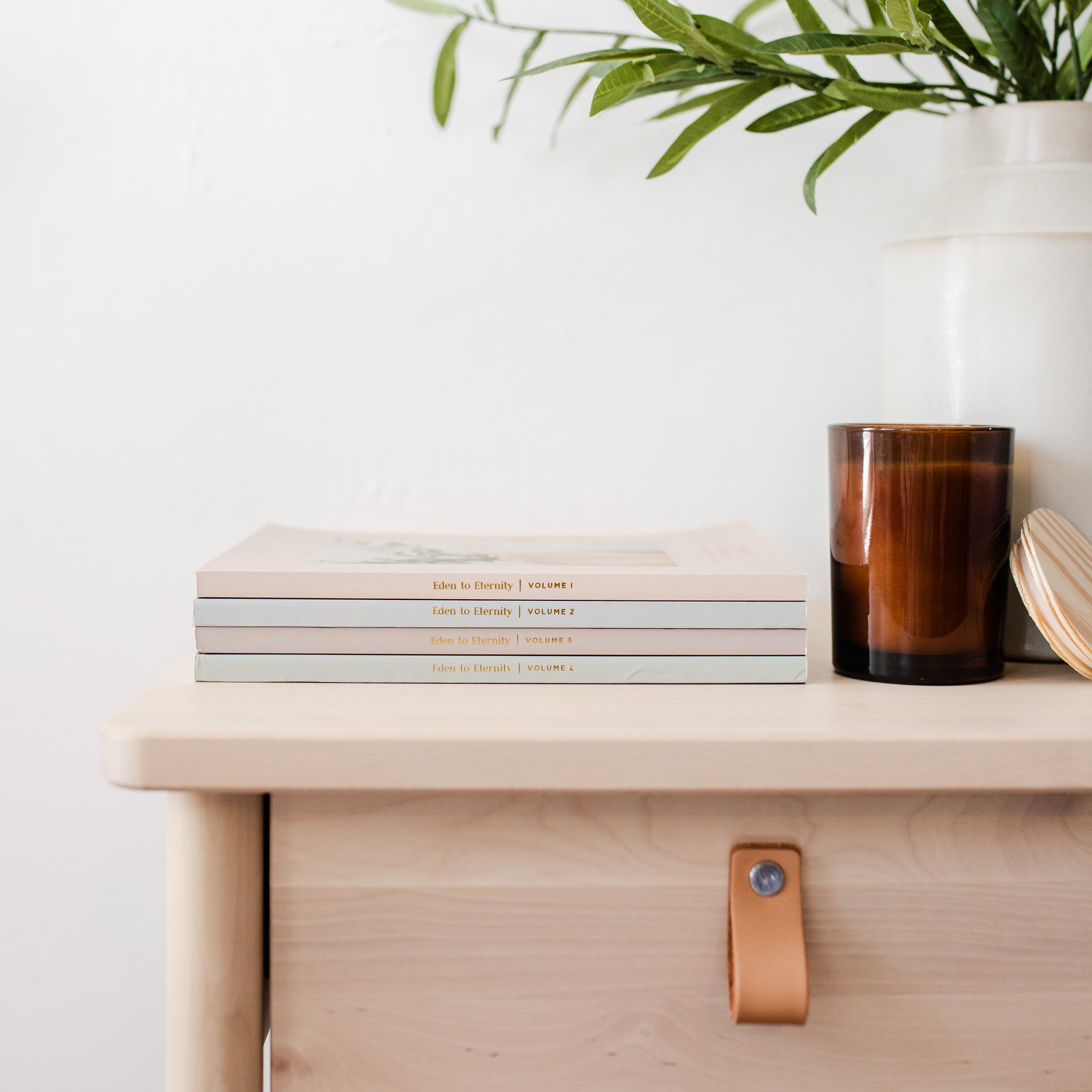 chronological bible study set on table with candle