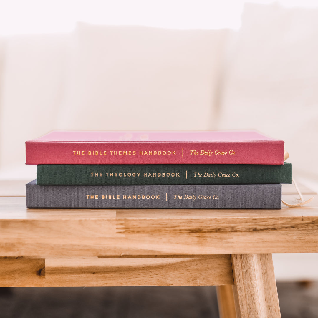 3 handbooks on table showing book spines