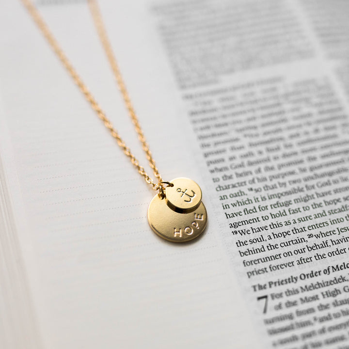 Christian womens necklace with anchor imprint on Bible 