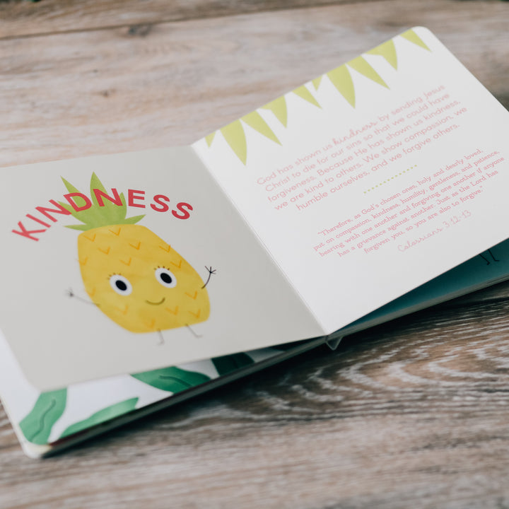 Children's book open to a drawing of a pineapple