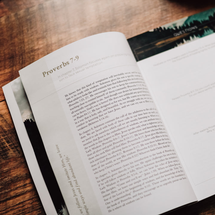 men's bible study opened to written text on pages