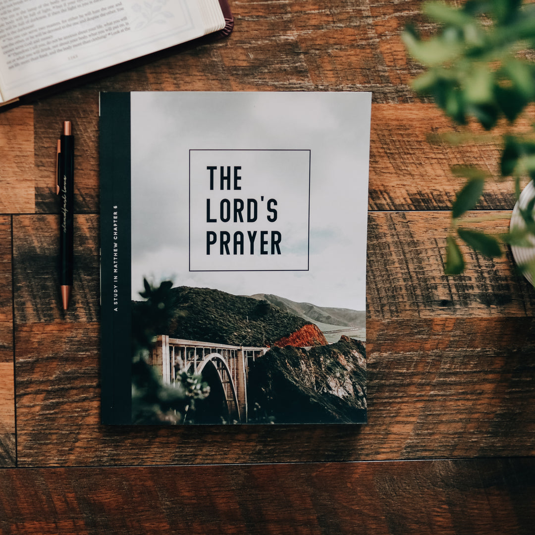 Men's Bible Study on table next to pen